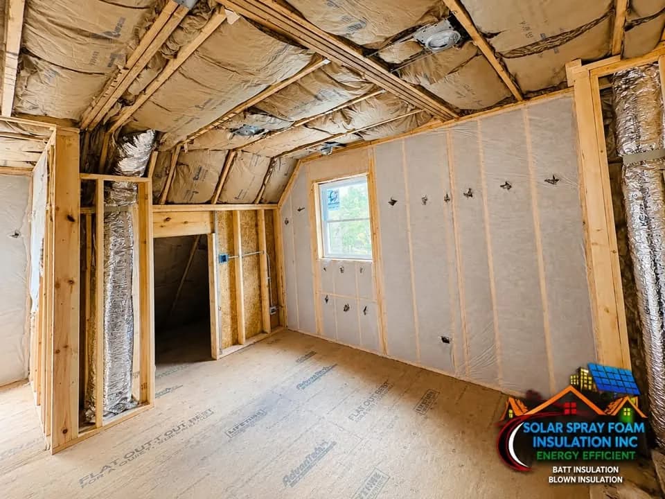 Reflective foil barrier and foil-faced ducting installed in an attic ceiling near Elgin, IL