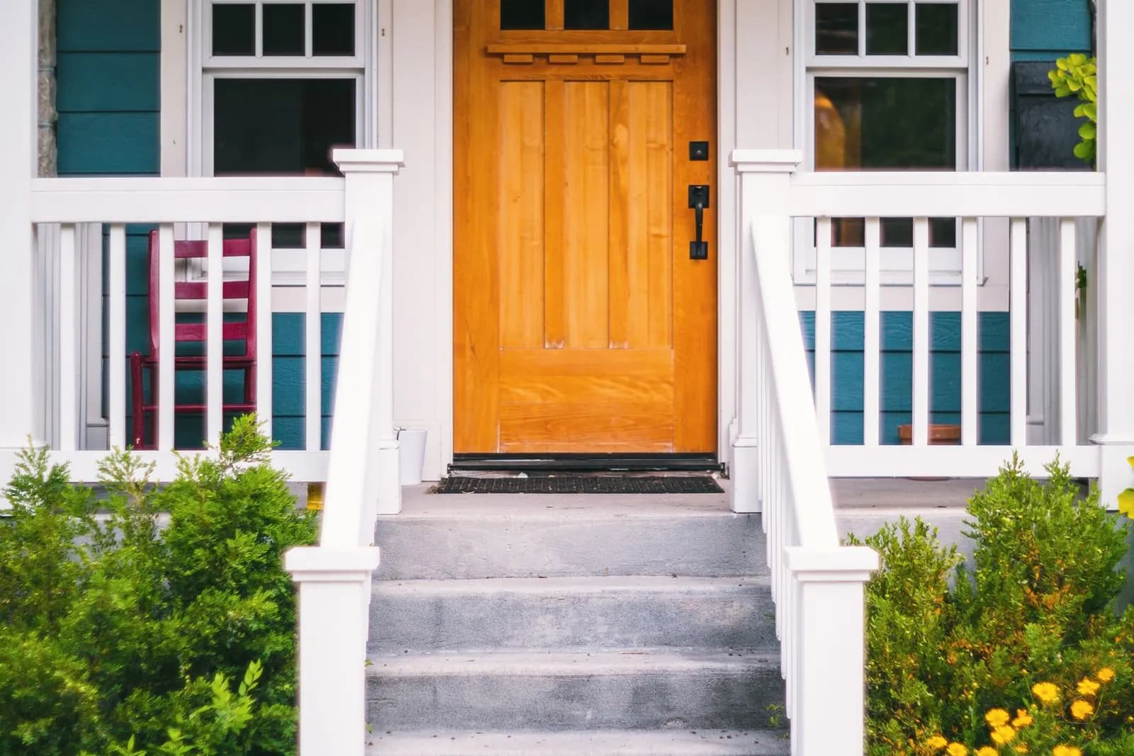 Front porch and door of a family home on a bright day