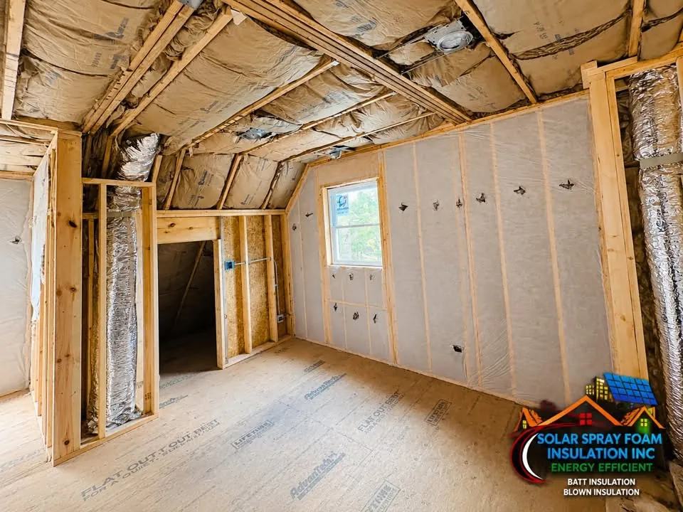 Reflective foil barrier and foil-faced ducting installed in an attic ceiling near Elgin, IL